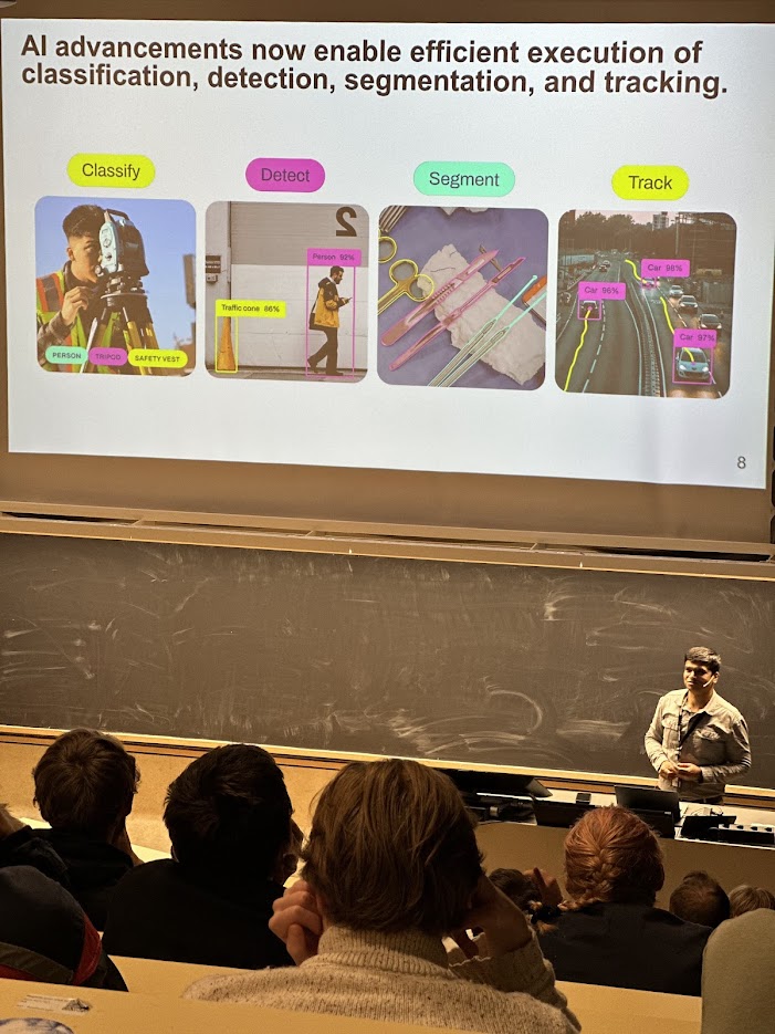 Sushant in front of one of his presentations about AI