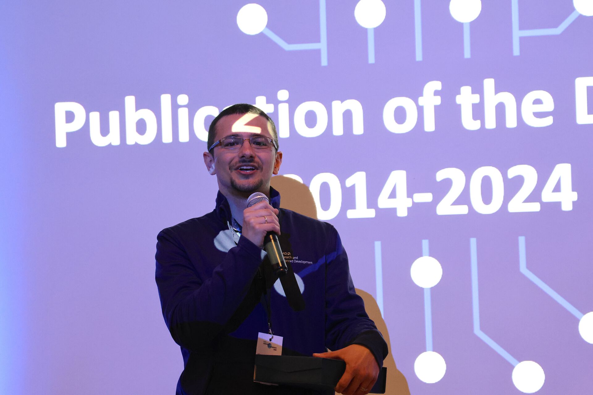 Yaman Umuroglu receiving the Publication of the Decade award. 