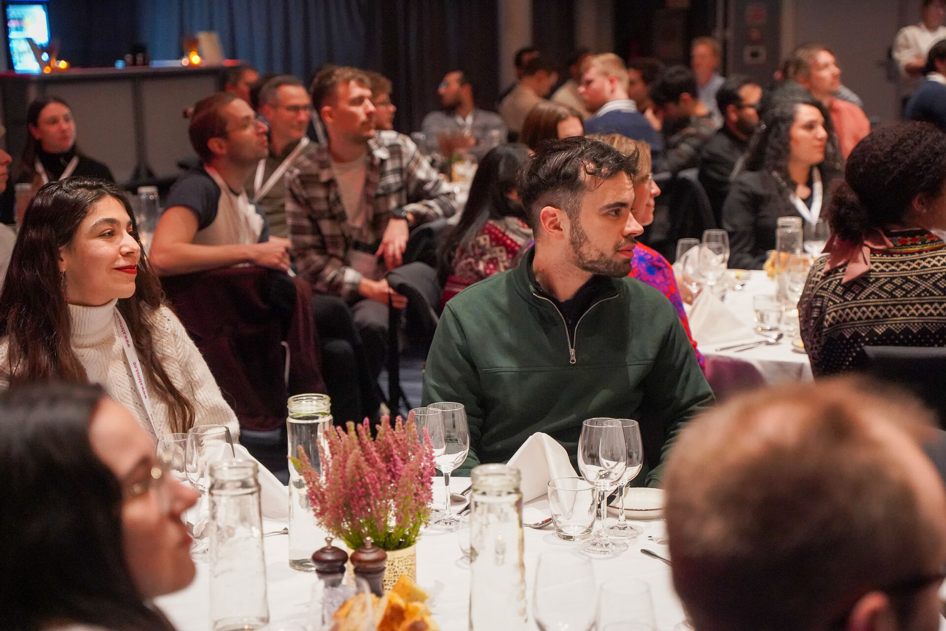 People seated around tables for dinner
