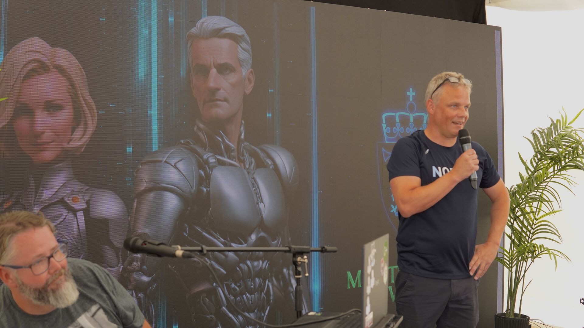 CEO of NORA, Klas Pettersen, in front of a screen