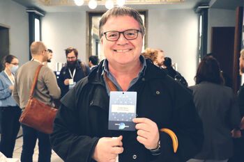 Glasses ,Smile ,Outerwear ,Vision care ,Coat.